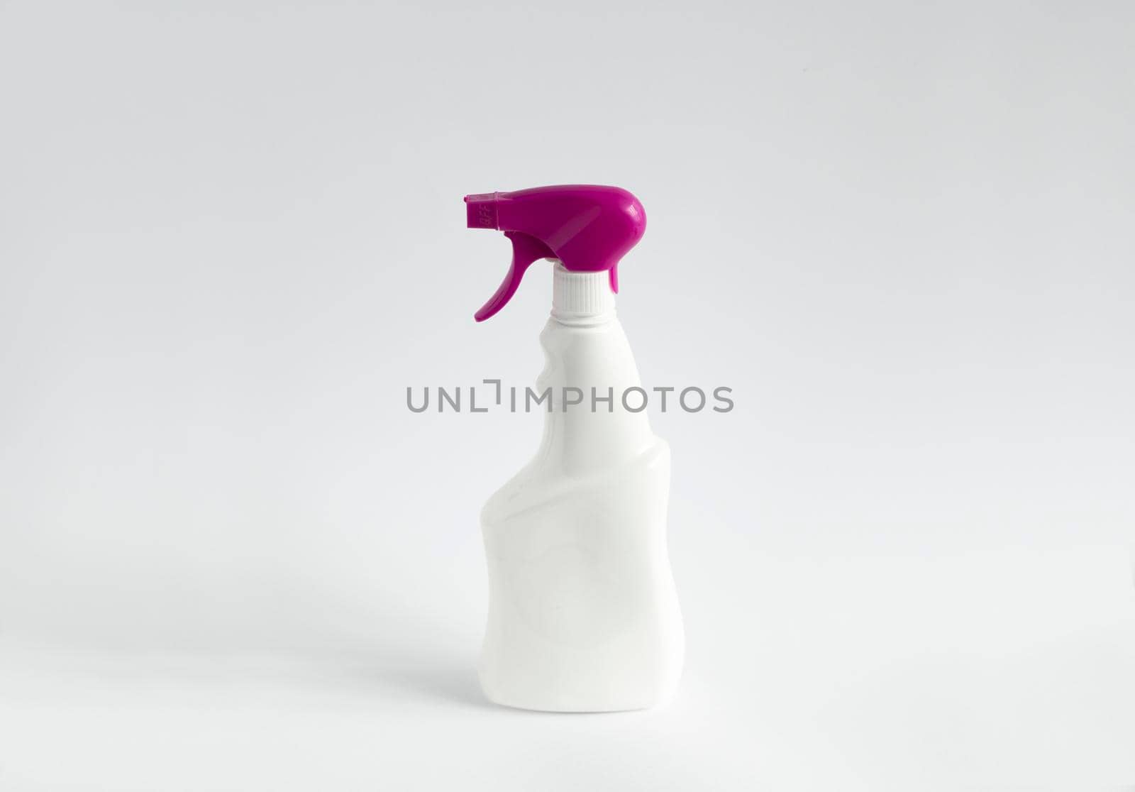 White detergent bottles or chemical cleaning supplies with a violet sprayer isolated on white background