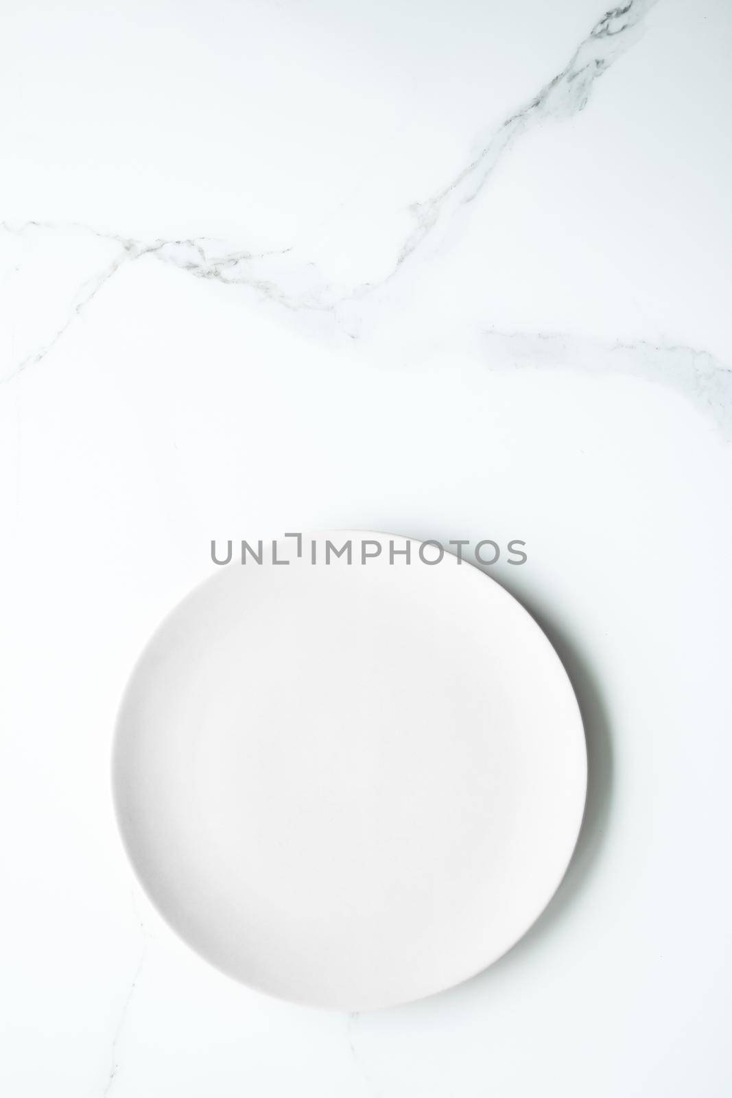 White empty plate on marble, flatlay - stylish tableware, romantic table decor and food menu concept. Serve the perfect dish