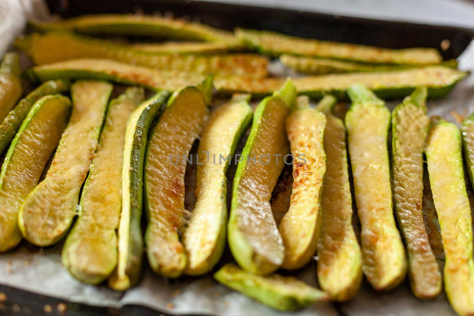 mini zucchini roasted with parmesan cheese, side view