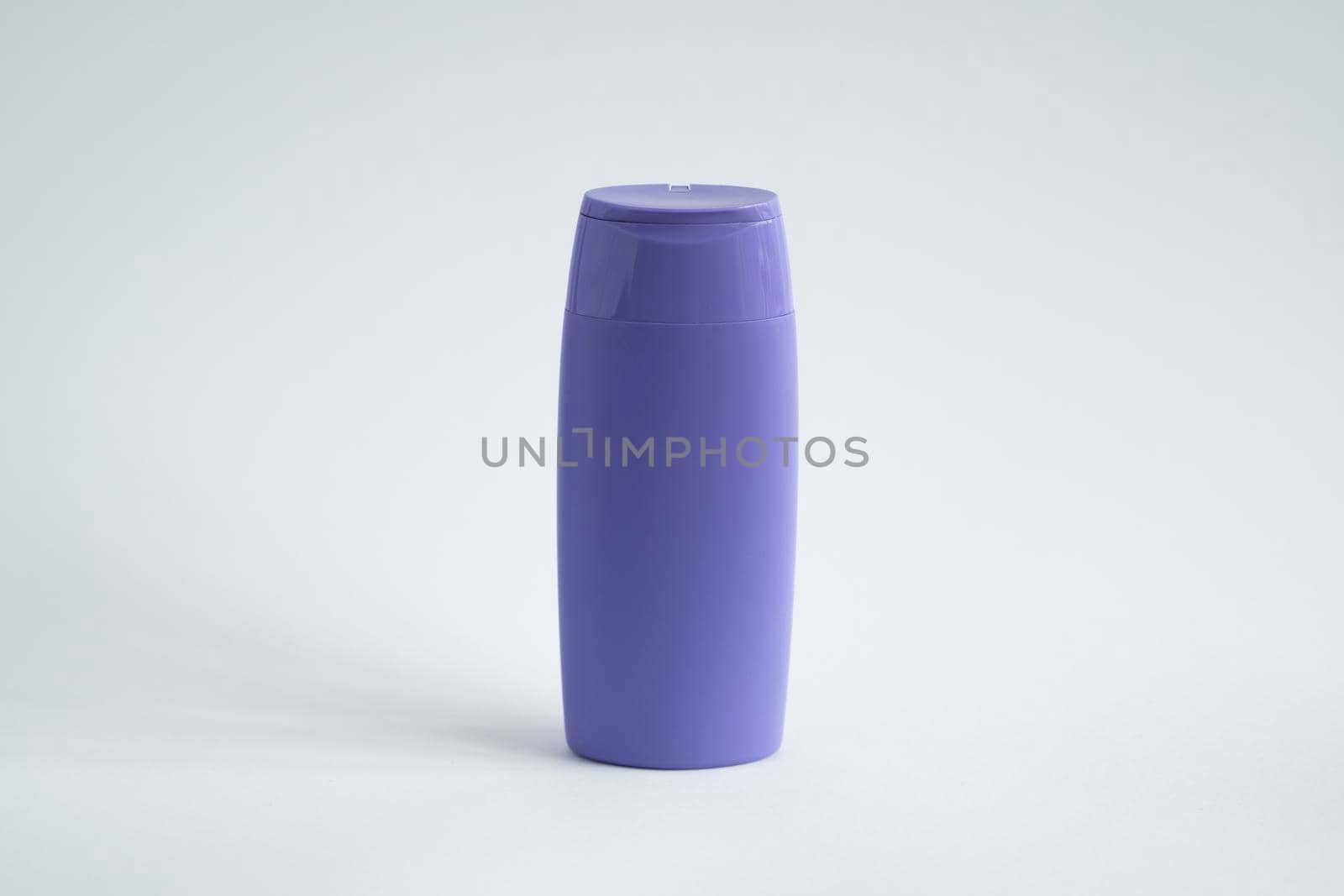 Violet blank plastic bottles isolated on white background