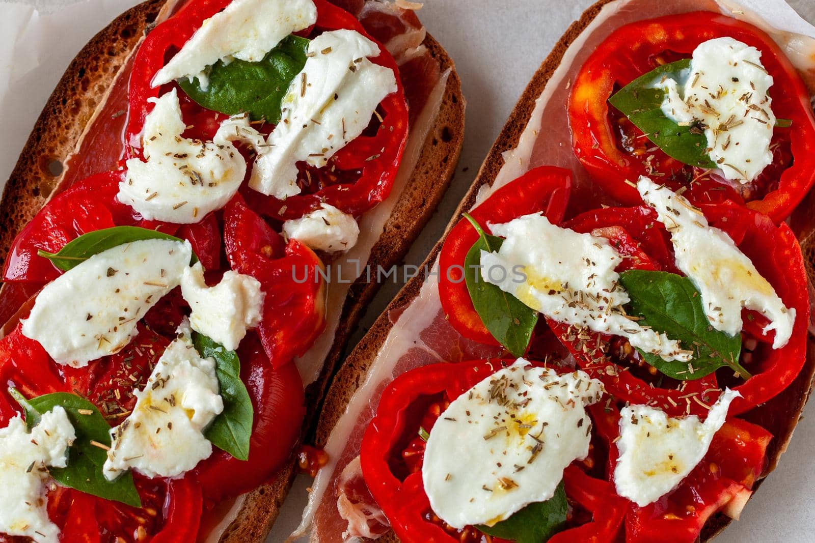 ham, tomato and mozarella toasts, top view