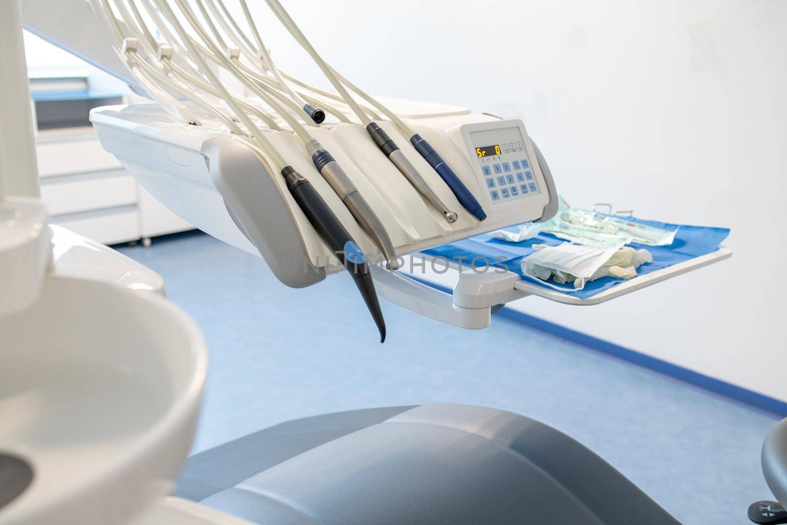 Modern dental practice. Dental chair and other accessories used by dentists