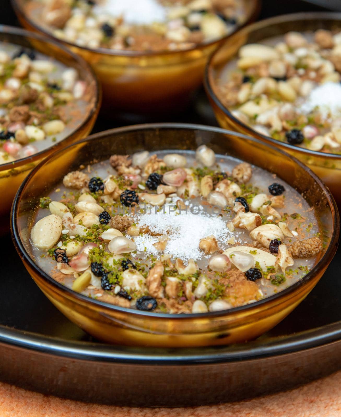 Traditional Turkish Dessert is Asure "Noah's Pudding" on wooden background