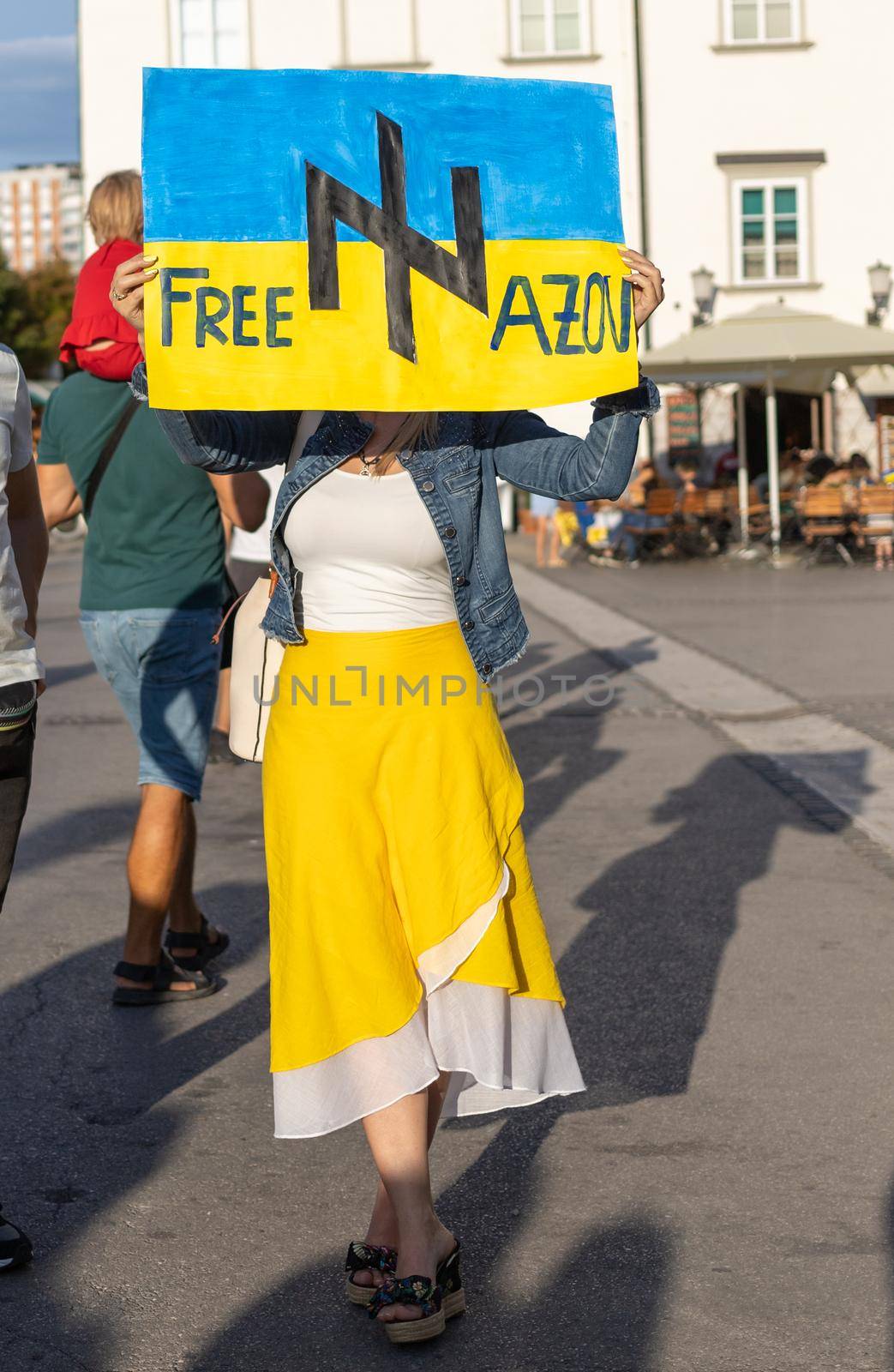 LJUBLJANA, SLOVENIA - August 24, 2022: Ukraine independence day meeting. People with flags and national symbols by Chechotkin