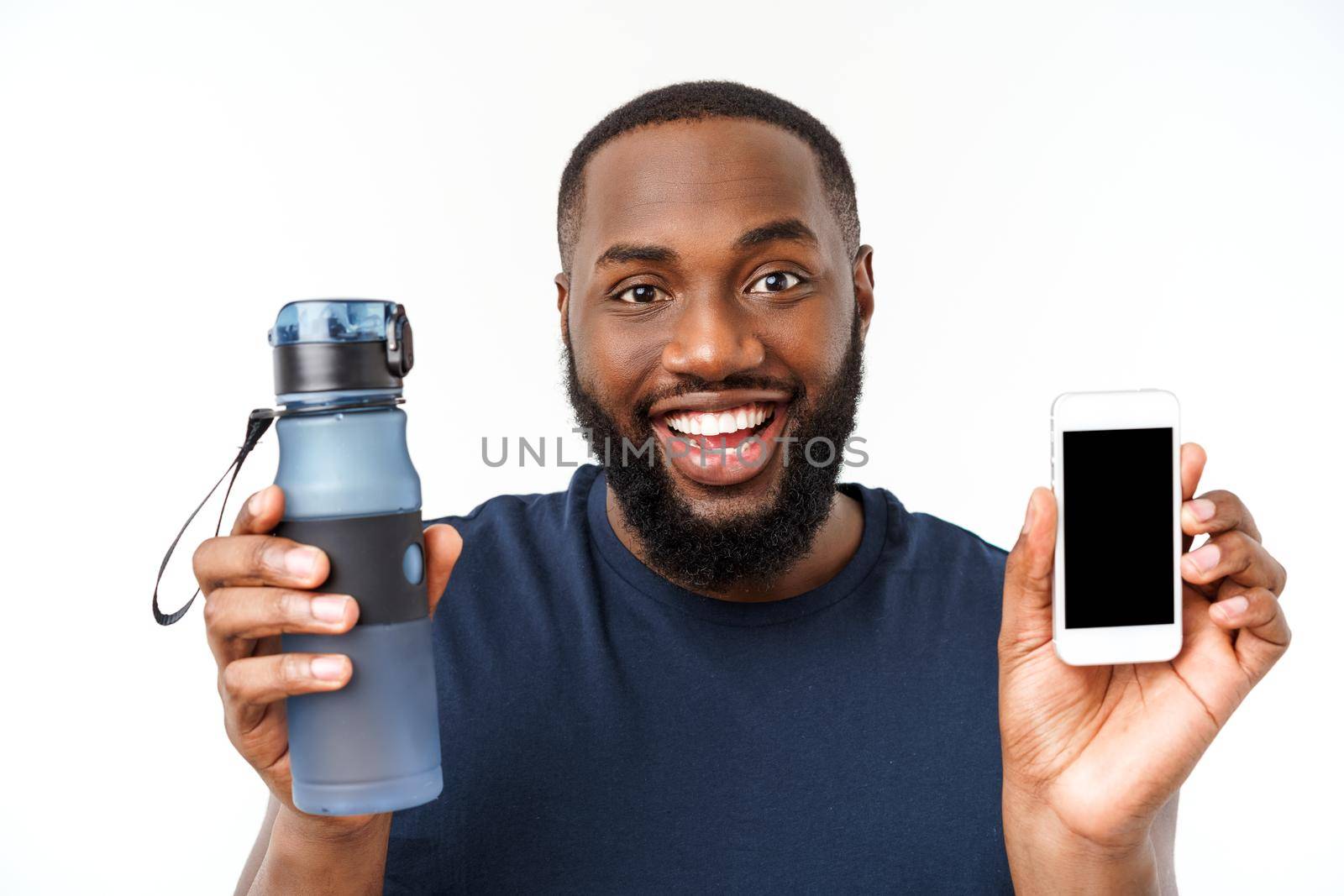 African american male athlete sport man with running sports with mobile phone and drinking water from glass