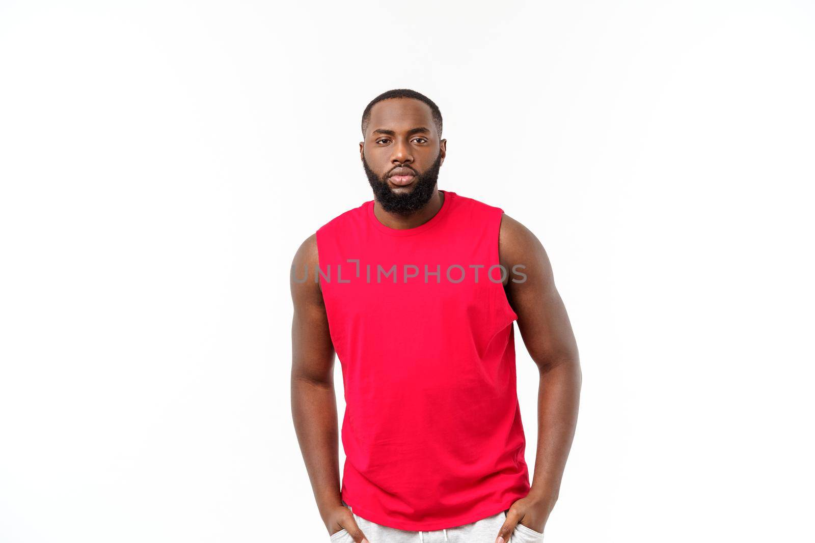 Young fitness african black man in sport wear cheering carefree isolated over white background