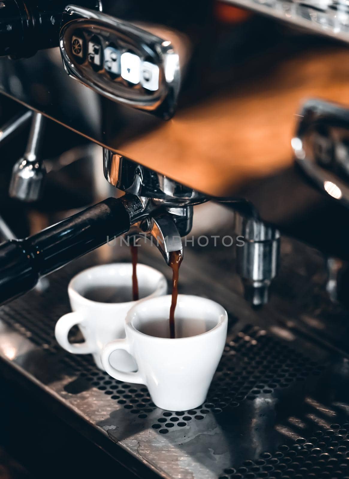 Espresso machine making coffee, golden espresso flowing. Coffee espresso