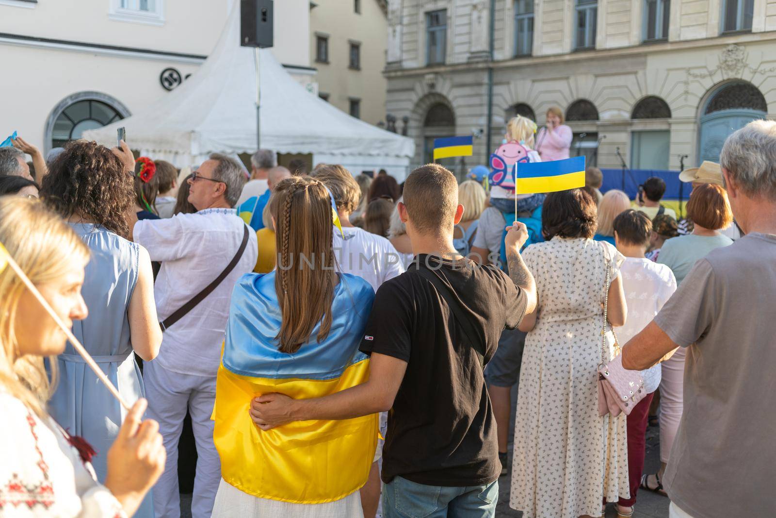 LJUBLJANA, SLOVENIA - August 24, 2022: Ukraine independence day meeting. People with flags and national symbols by Chechotkin