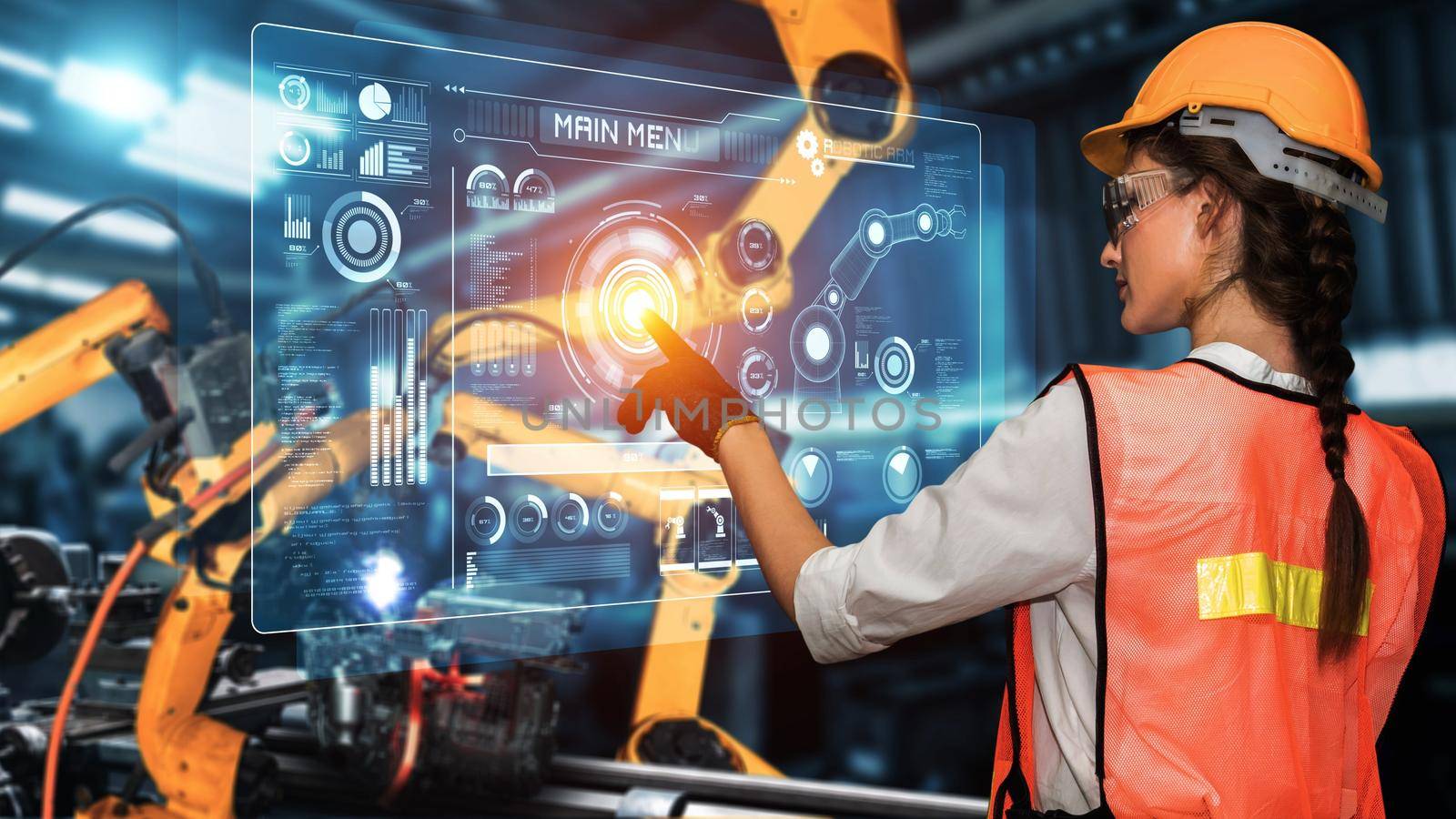 Engineer use cybernated robotic software to control industry robot arm in factory . Automation manufacturing process controlled by specialist using IOT software connected to internet network .