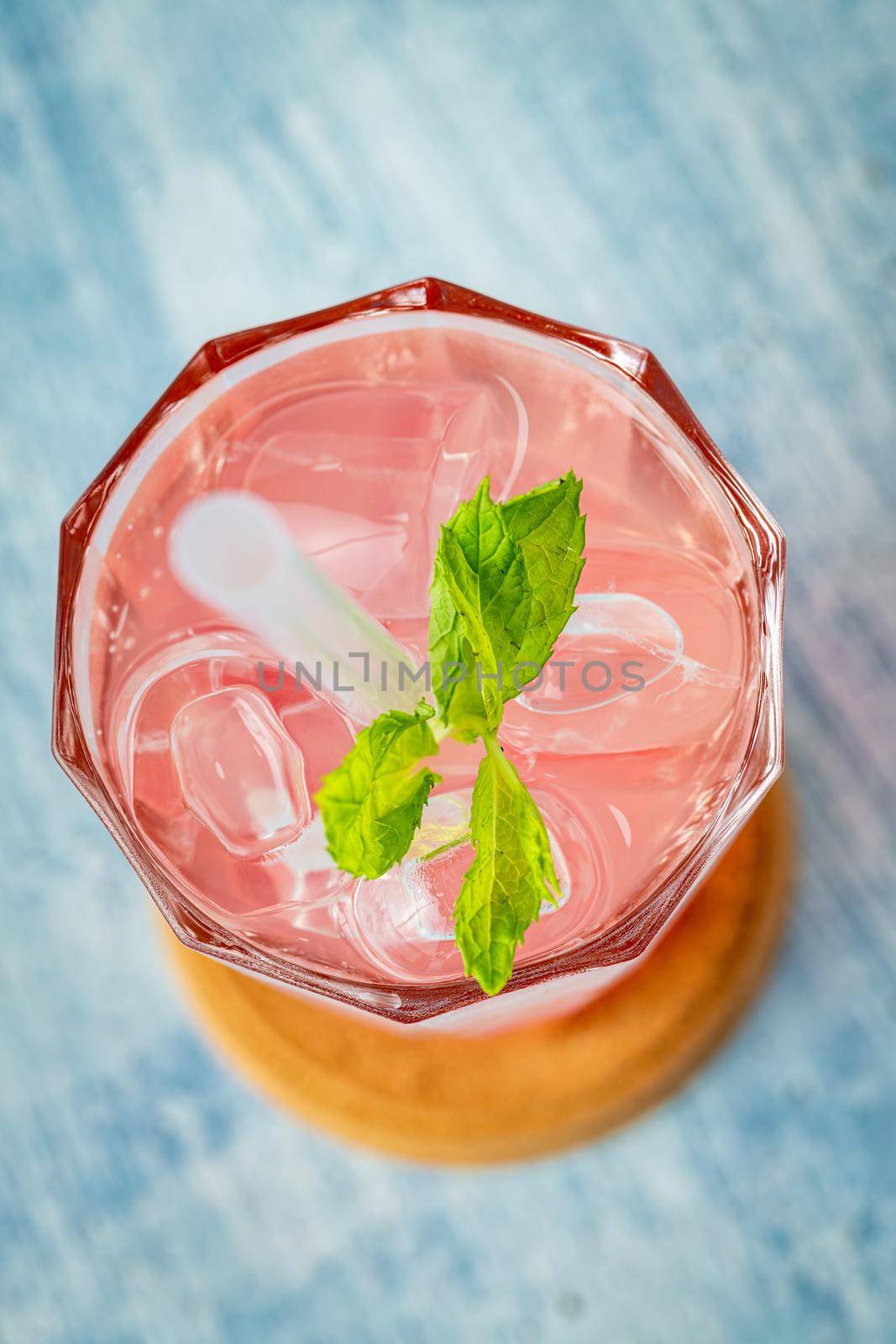 Fruity Bubble Tea in glass cup on blue background