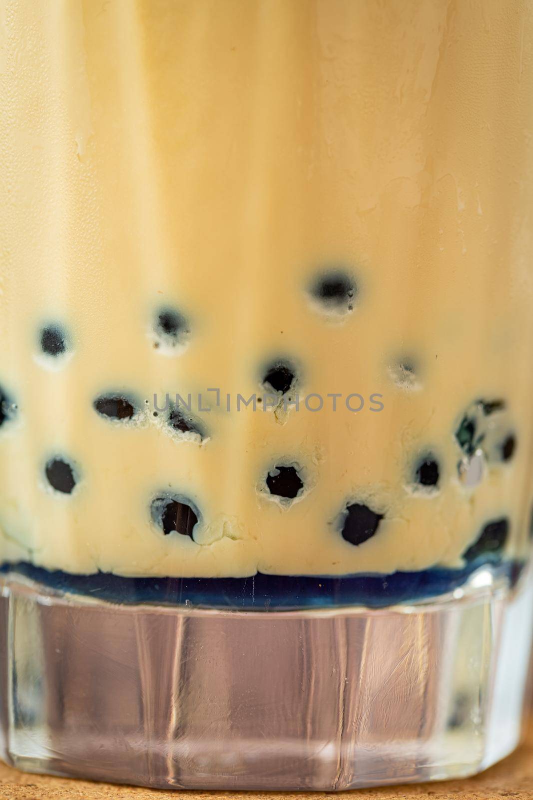 Fruity Bubble Tea in glass cup on wooden background