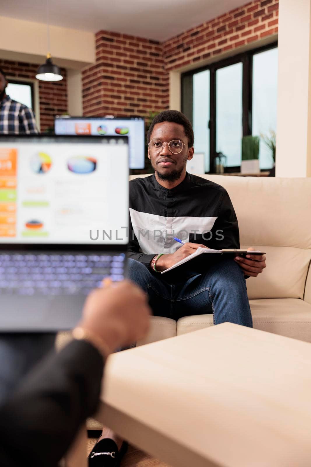 Business people working on data charts with research information, doing teamwork to plan diagrams presentation and internet report. Colleagues doing office collaboration in startup company.