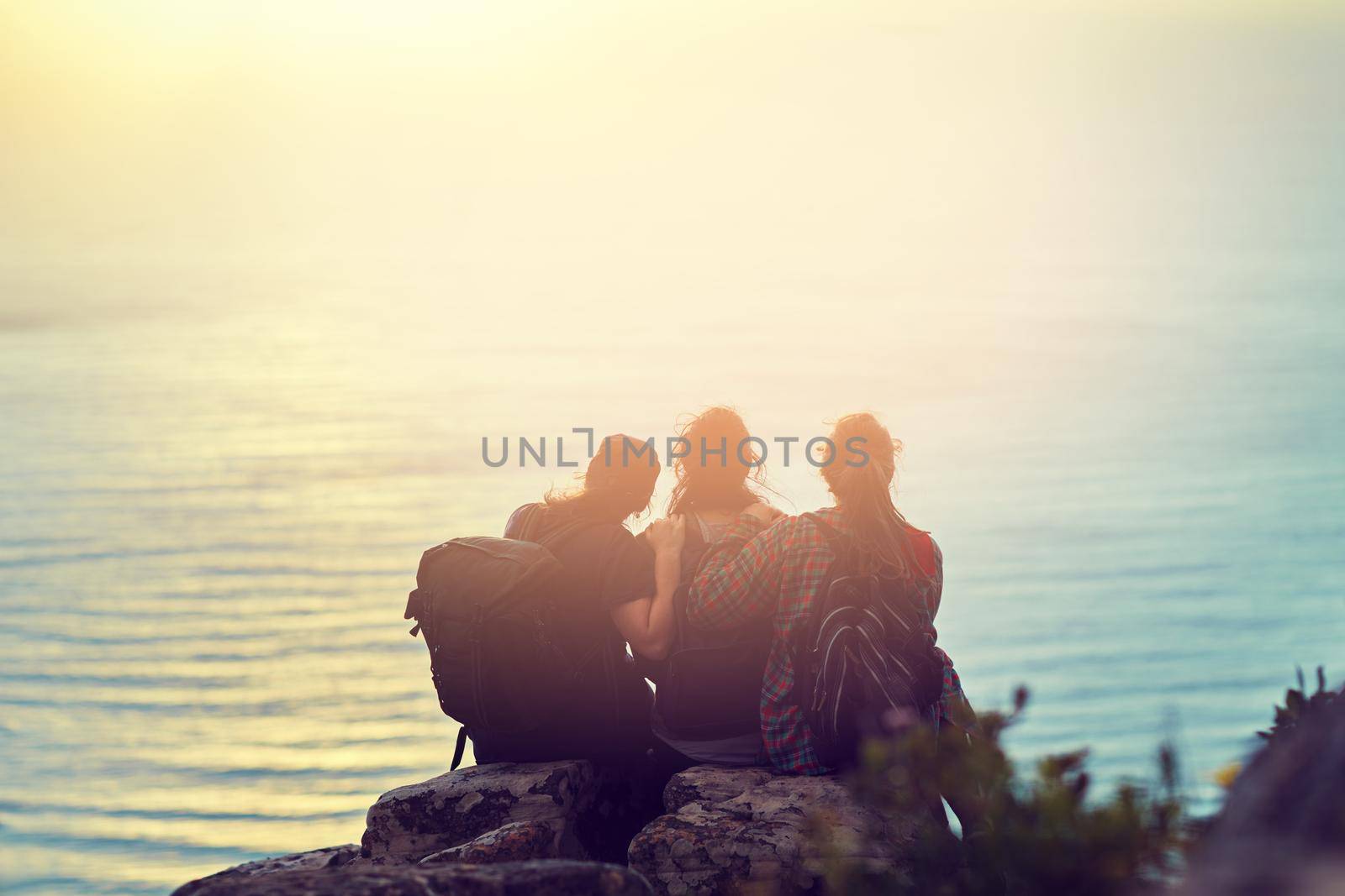 Enjoy the small luxuries in life. a group of friends on a mountain top