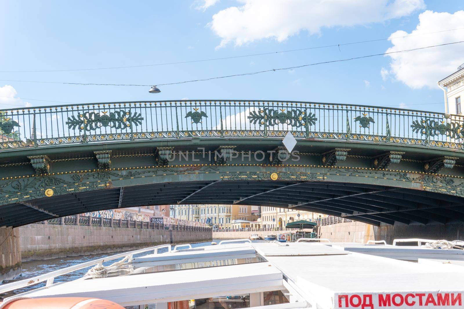 RUSSIA, PETERSBURG - AUG 20, 2022: bridge architecture transportation engineering design construction sky tower, for building red in urban from metal water, arvel beam. Bay long, sky