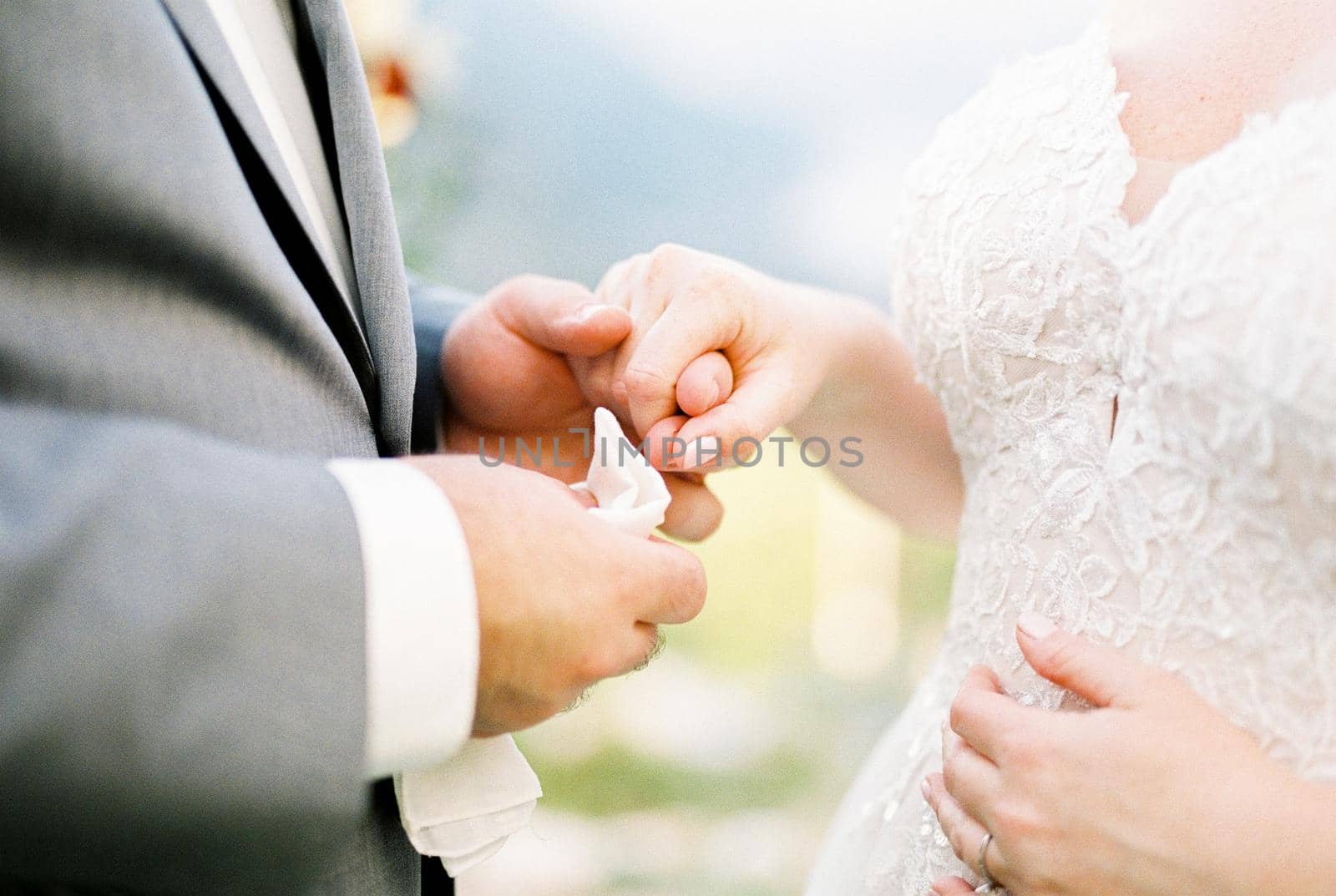 Groom holding bride hand. Close-up. High quality photo