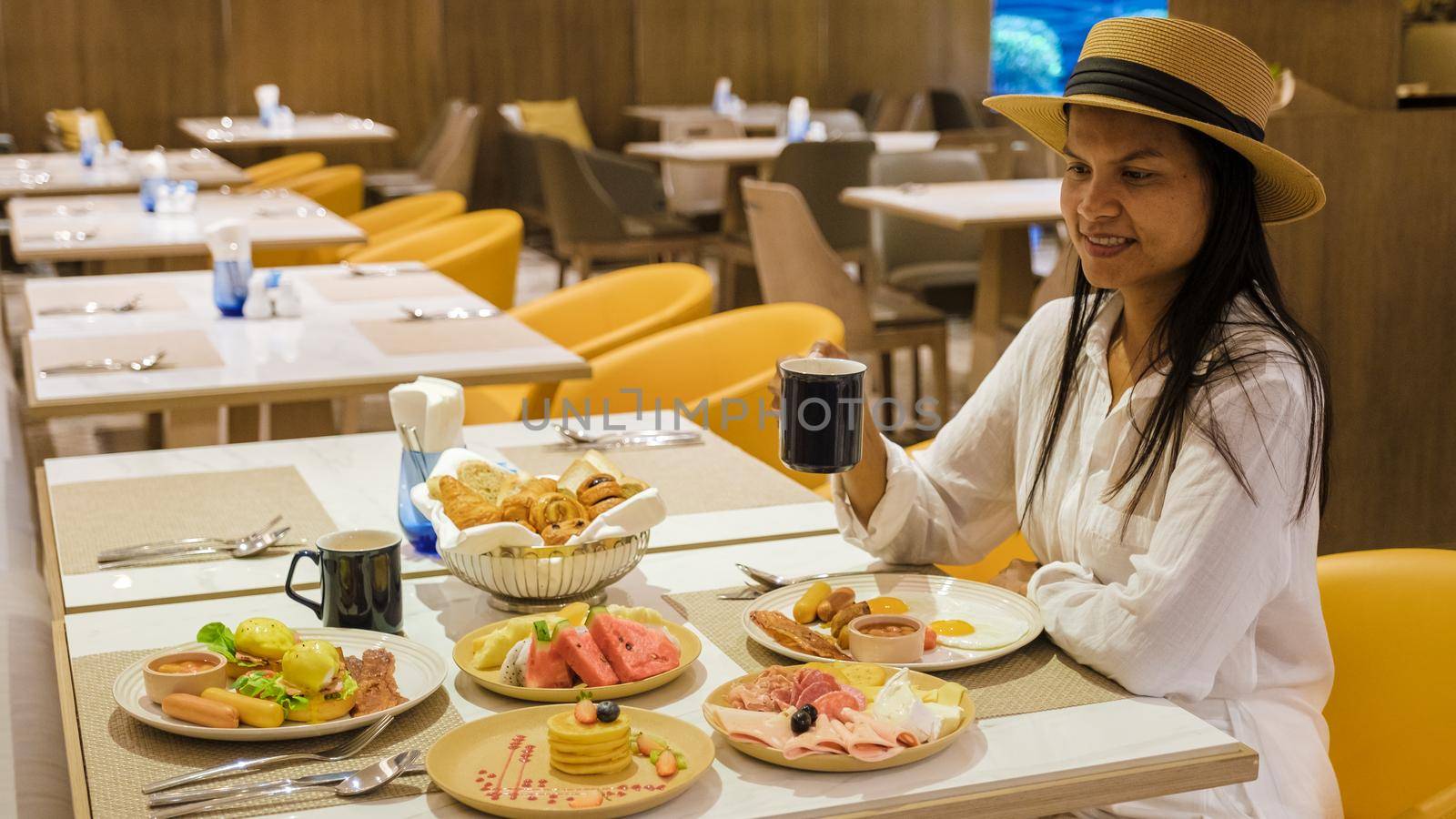 Asian women having a Breakfast buffet in a luxury hotel.