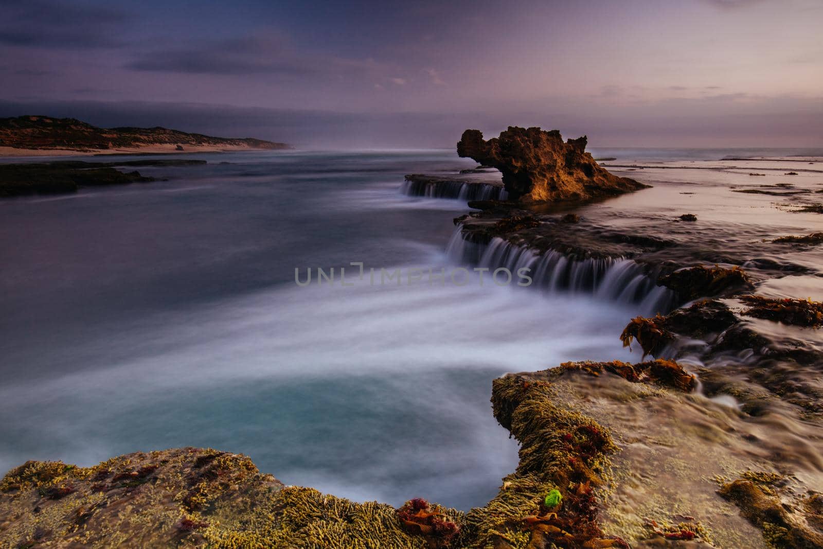 The iconic Dragon Head Rock at sunset on the Number Sixteen Beach in Rye, Victoria, Australia