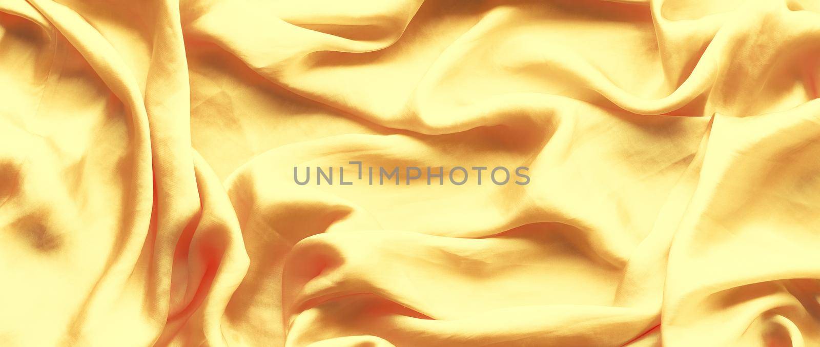 Luxury golden silk background texture - elegant fabric textures, abstract backgrounds and modern pastel colours concept