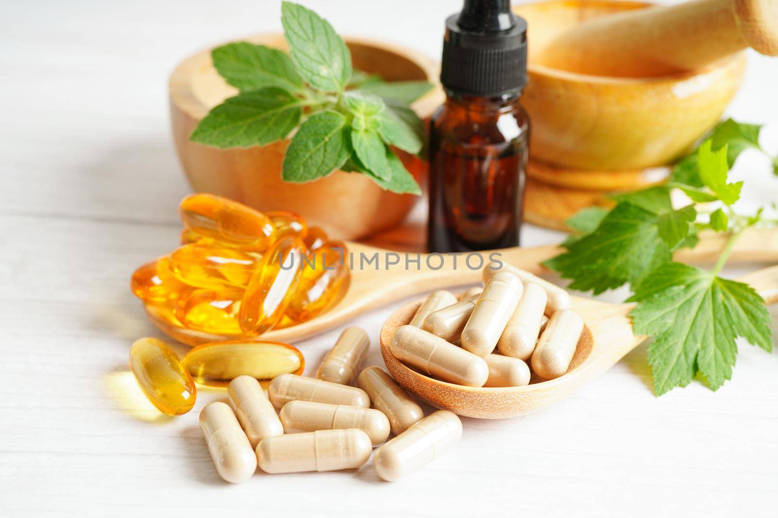 Alternative medicine herbal organic capsule with vitamin E omega 3 fish oil, mineral, drug with herbs leaf natural supplements for healthy good life.