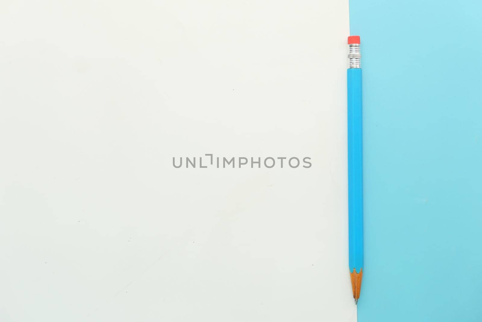 Close up of blue color pencils on color background