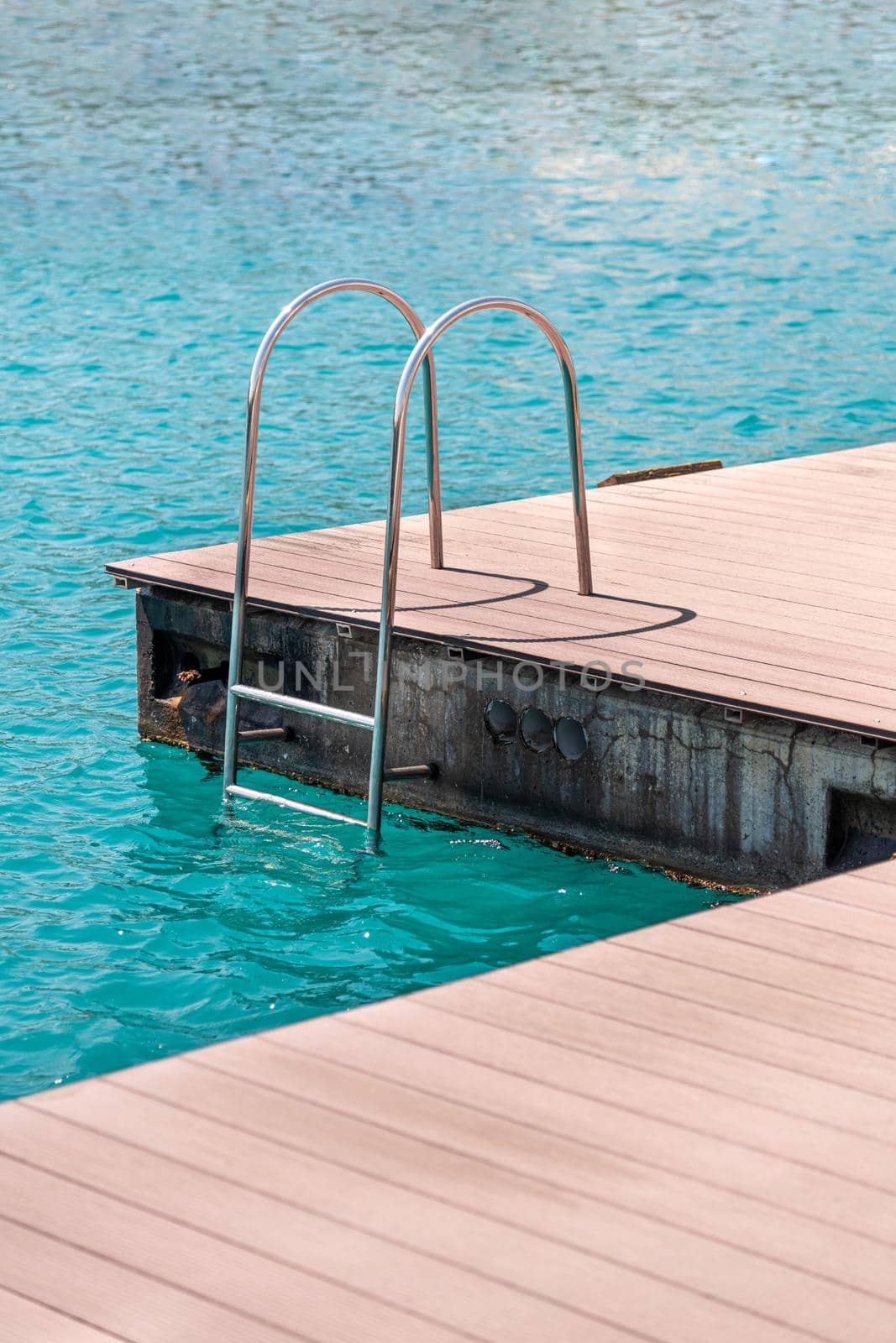 floating dock with composite deck and ladder at the marina. by Sonat