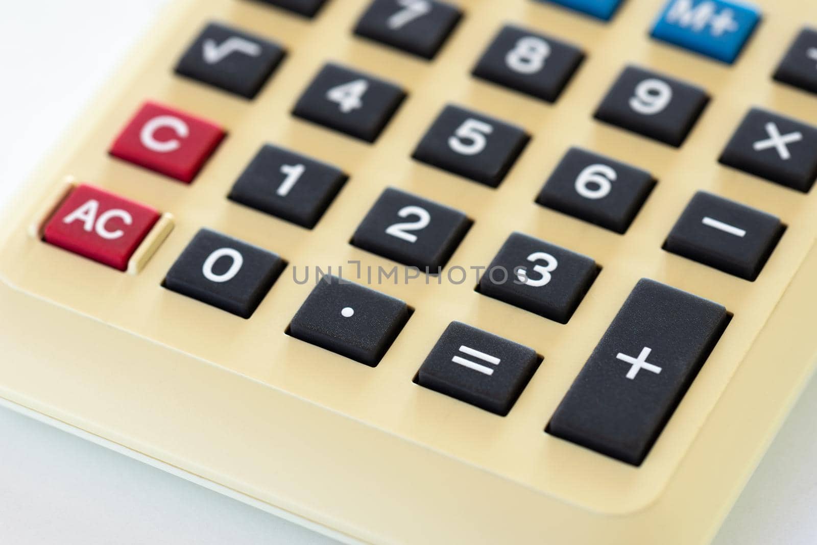 Detail of an old home calculator isolated on white backghround