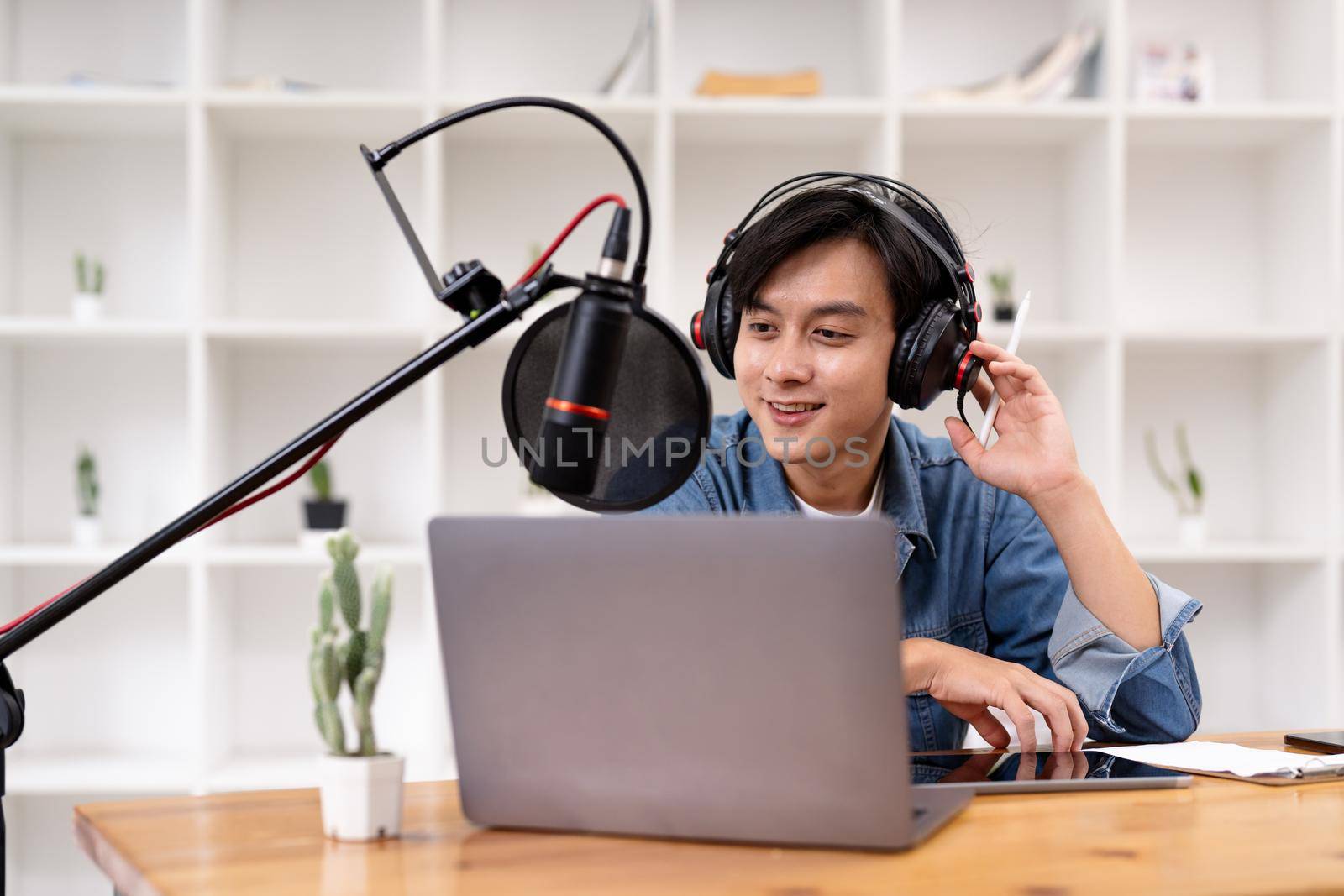 Man and woman podcasters interview each other for radio podcast.