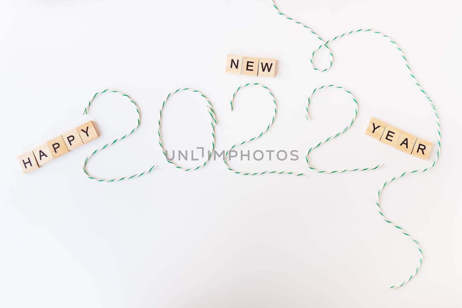 Holiday concept for Christmas and New Year 2022. Layout of various Christmas attributes - striped threads for packaging. View from above. by sfinks