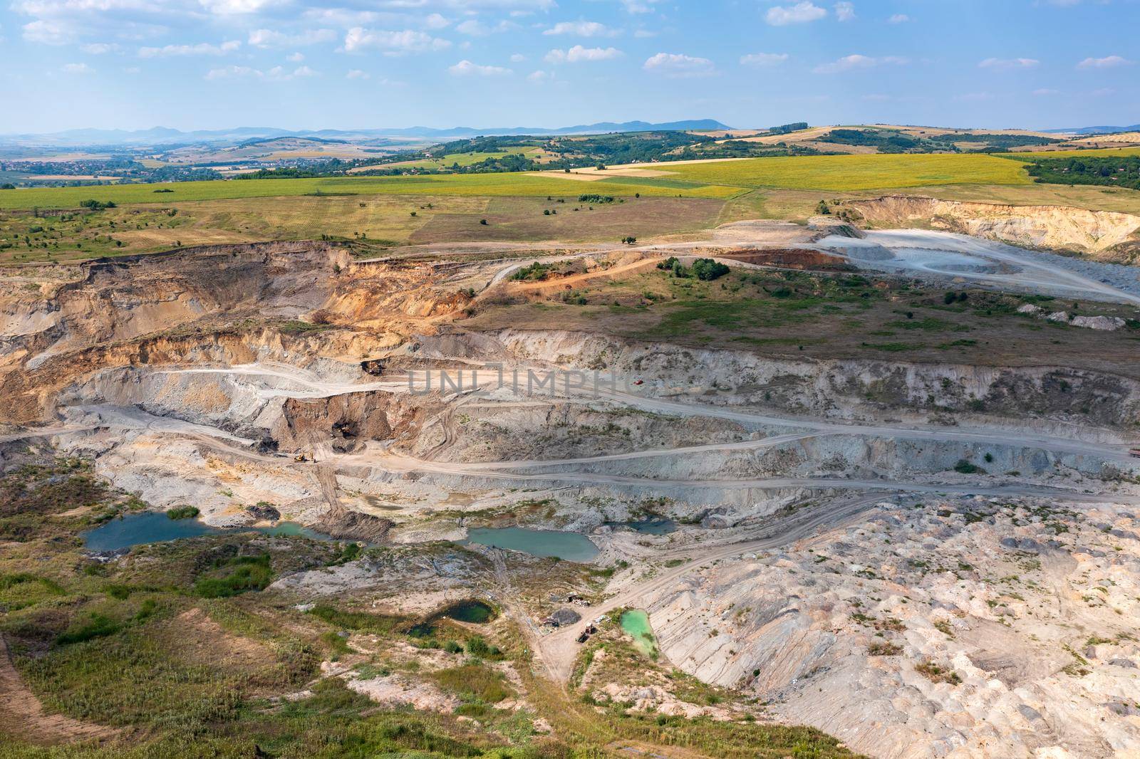 Aerial drone view flight over a quarry. Mining industry.
