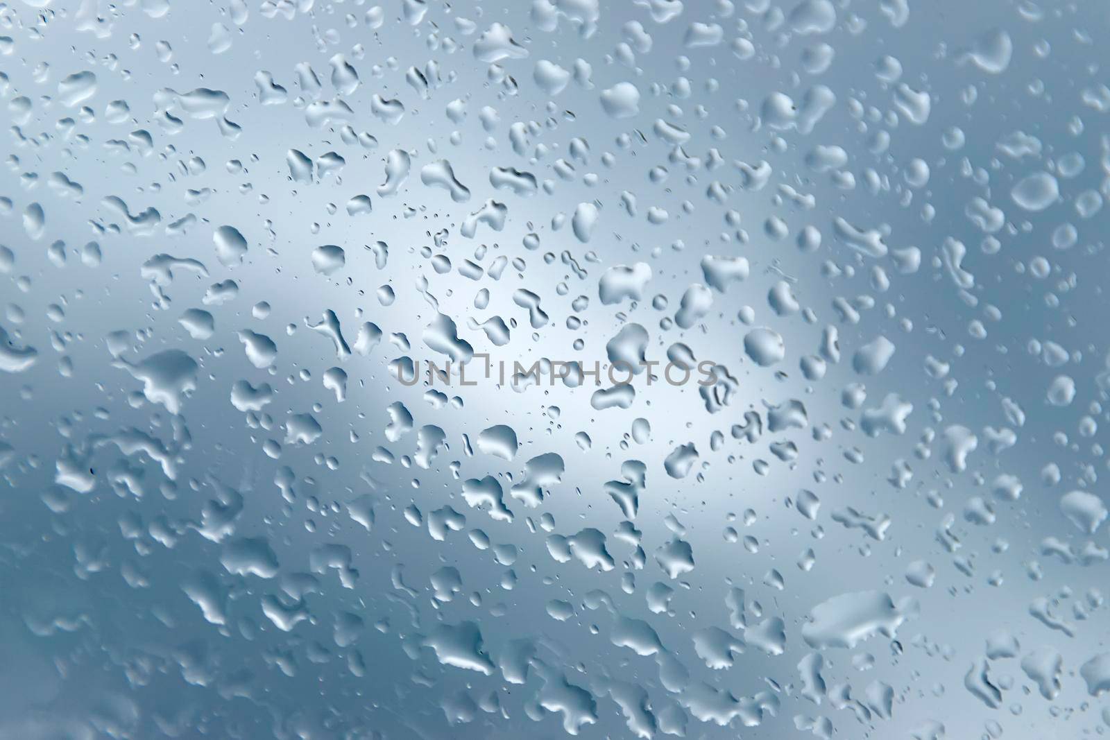 Close up of a window with raindrops. 