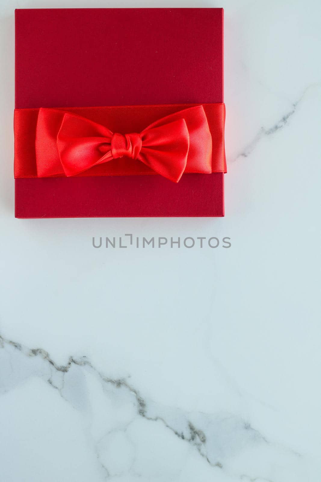 Luxury red holiday gifts on marble by Anneleven