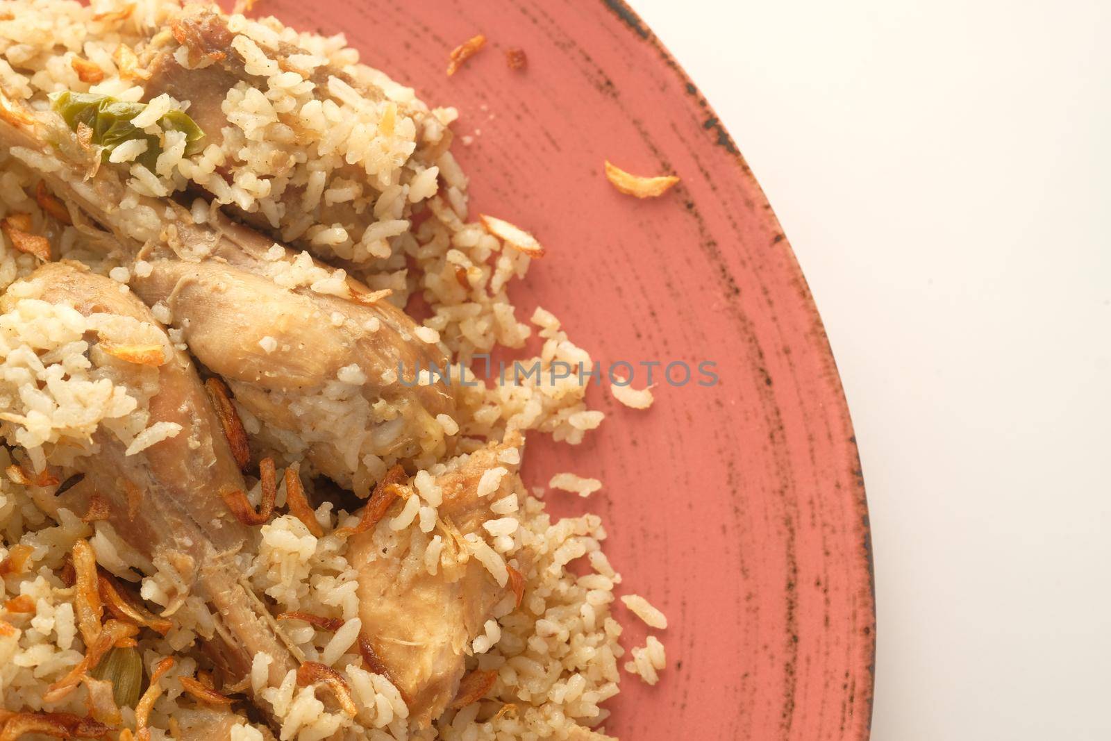 chicken biryani meal in a bowl on table