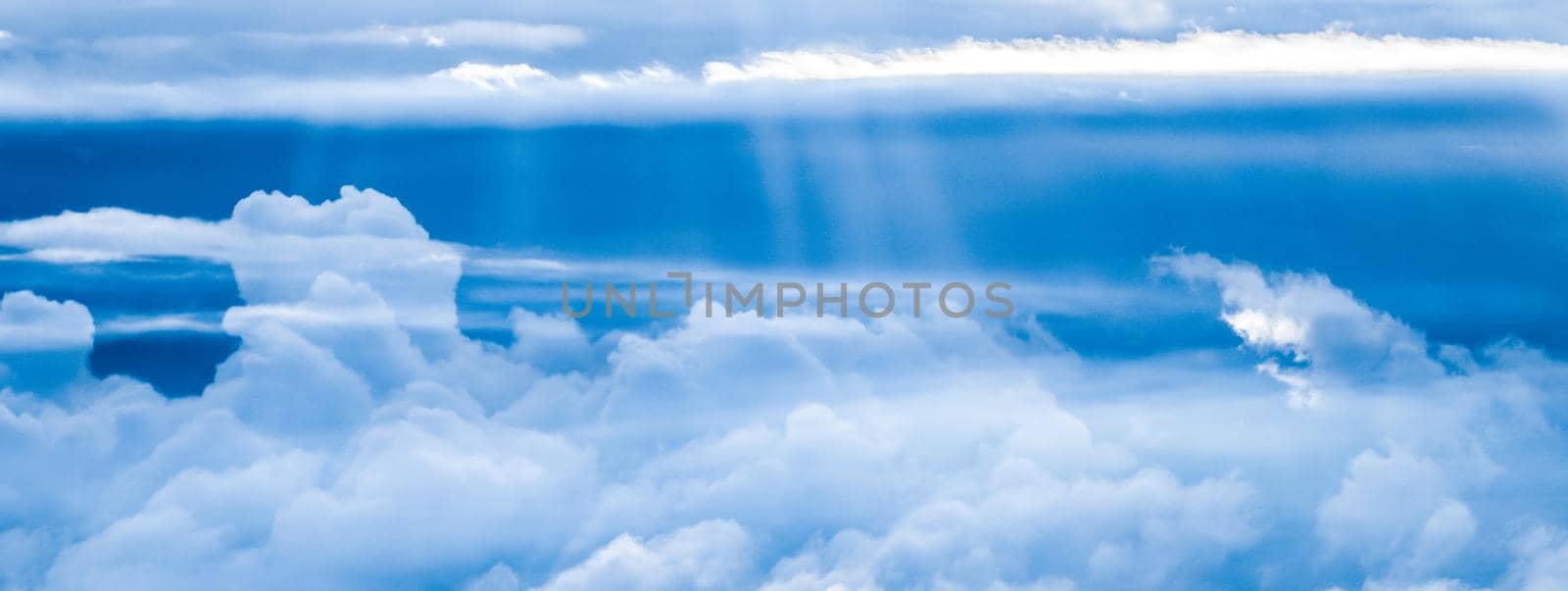 Nature backdrop, solar energy and spiritual concept - Blue sky background, white clouds and bright sunlight