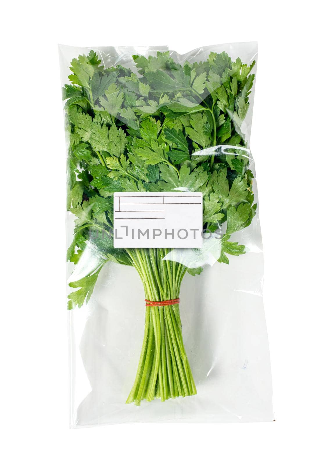 Packaged and labeled organic parsley on a white background