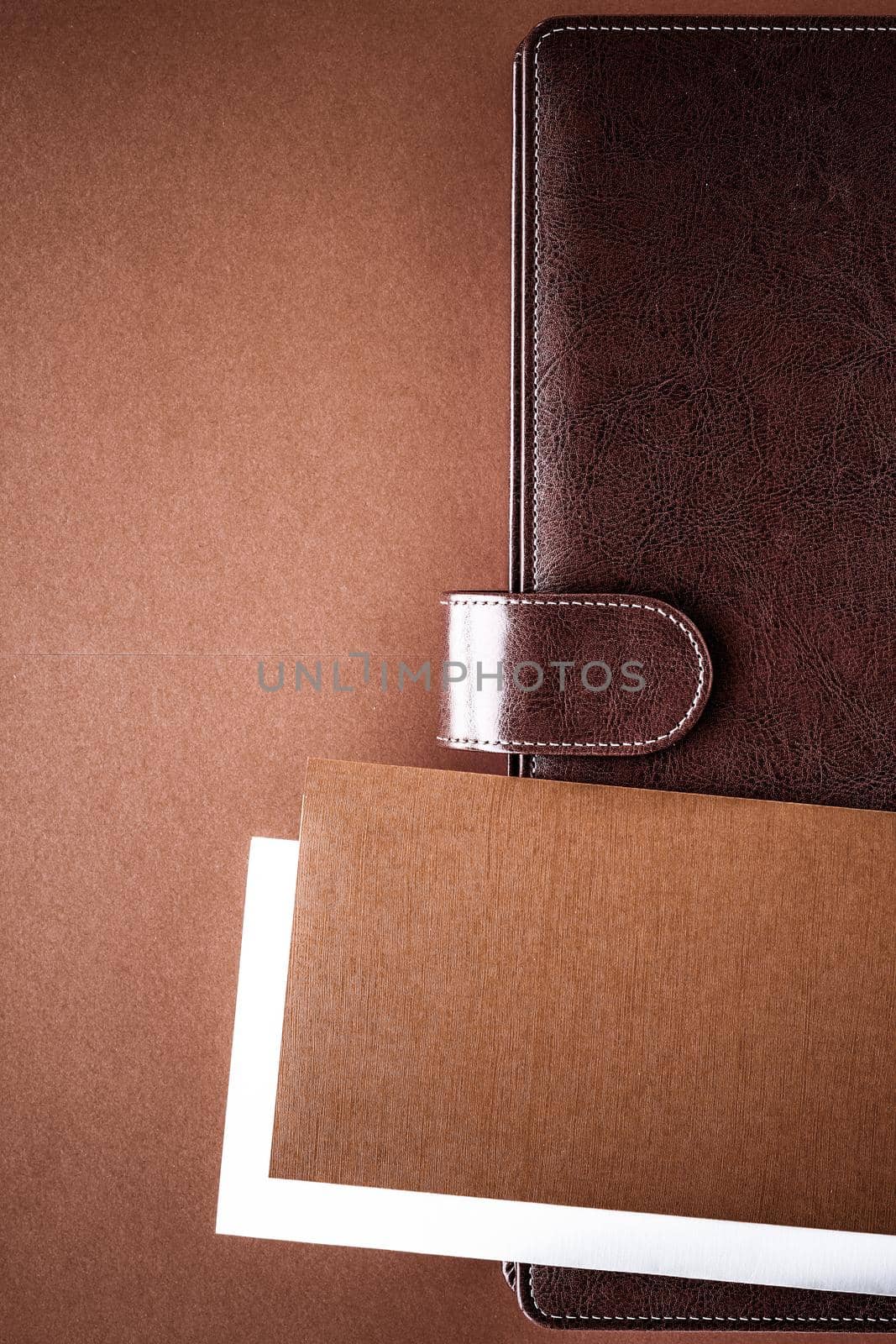 Vintage business briefcase on the office table desk, flatlay background by Anneleven