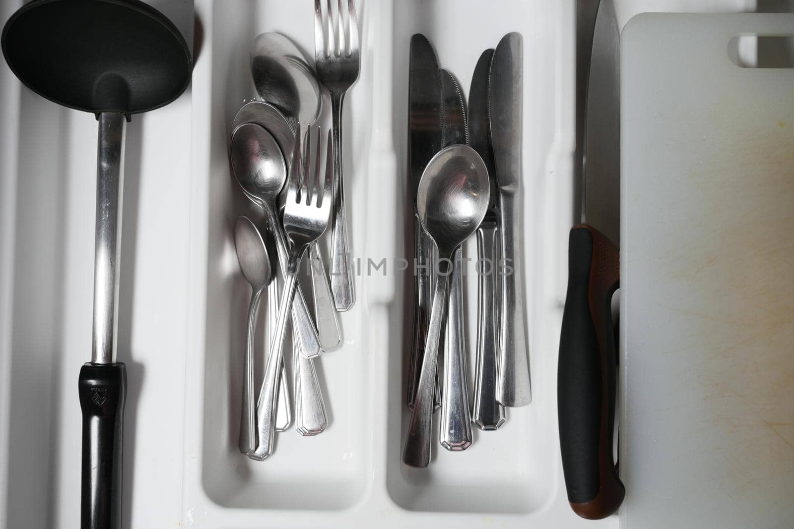 fork, knife and spoon on in a drawer top view ,