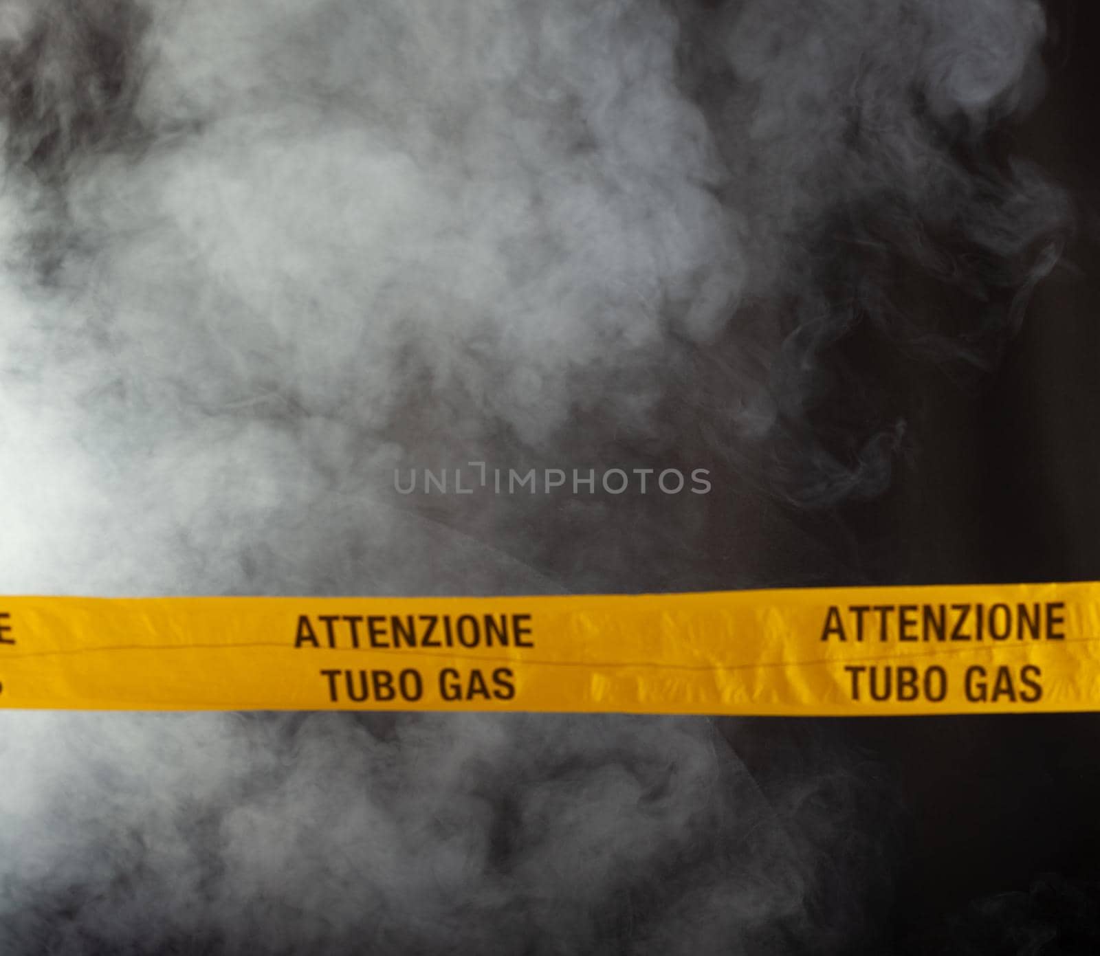 Yellow emergency sign of attention gas pipe on smoke-filled background by bepsimage