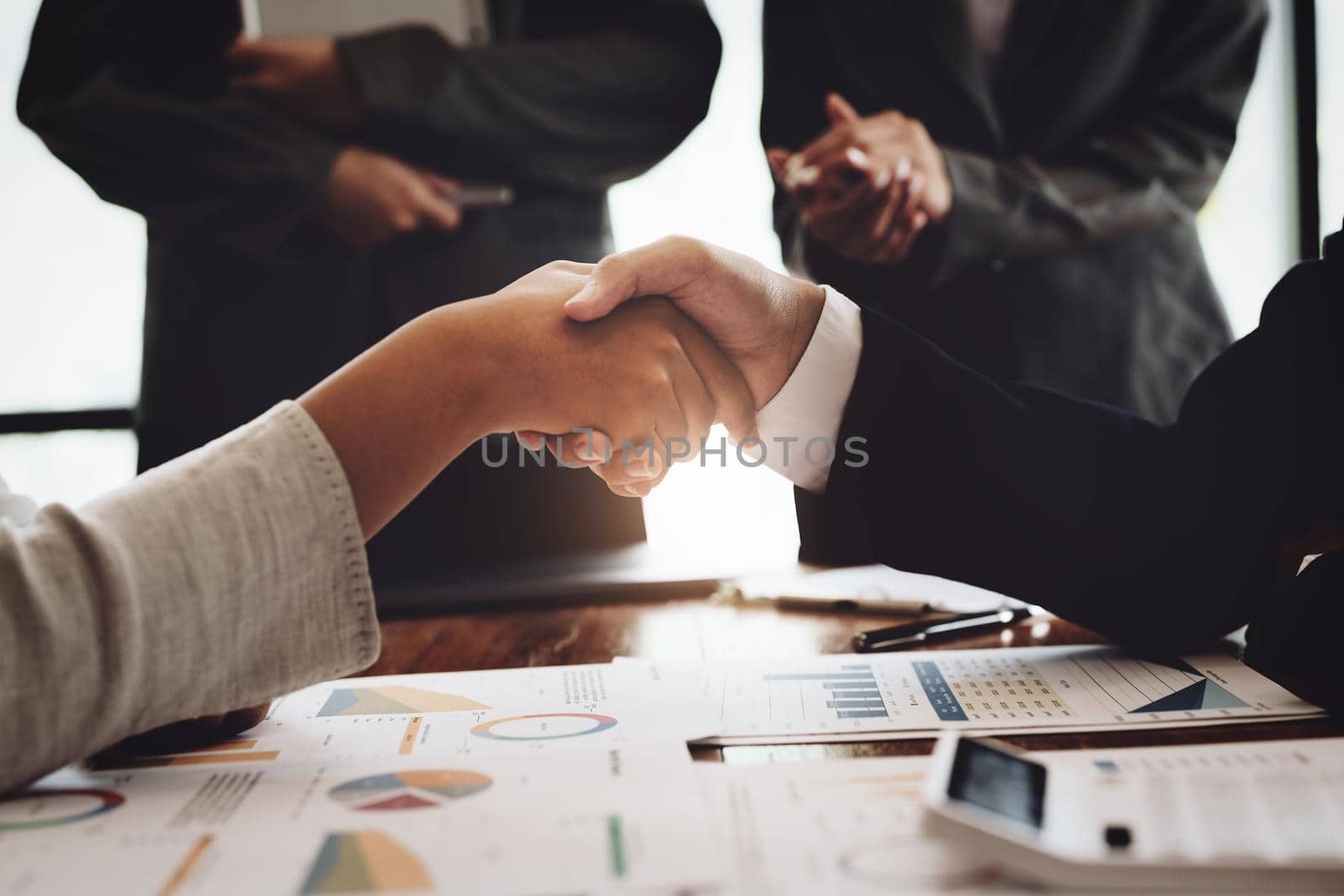 The handshake symbolizes the merger, together concept. by Manastrong