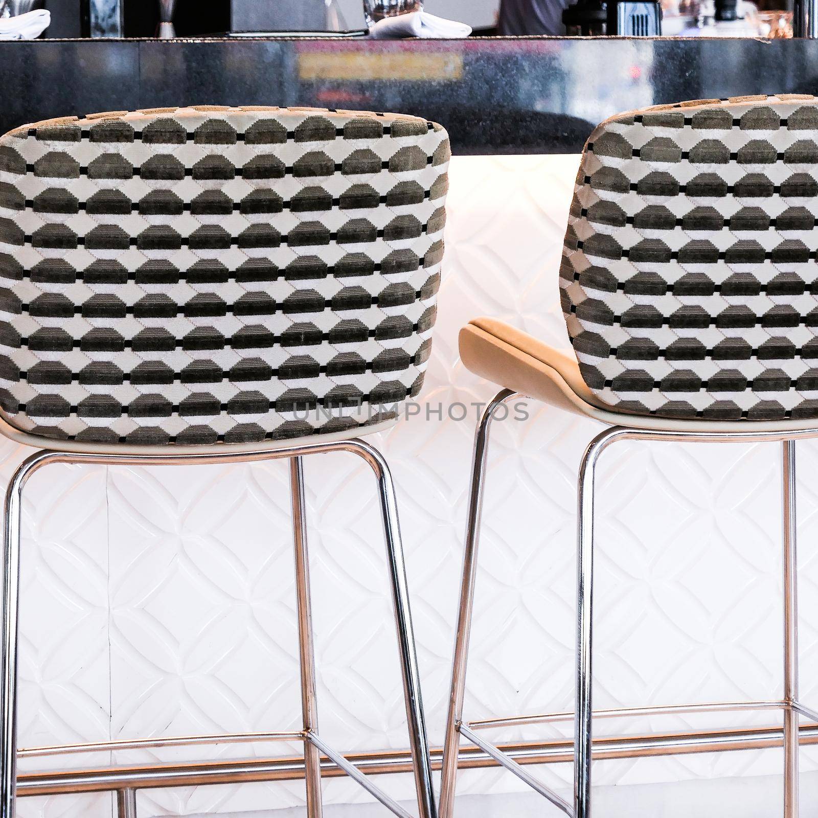 Interior design, furniture decor and nightlife concept - Modern bar stool in a luxury restaurant