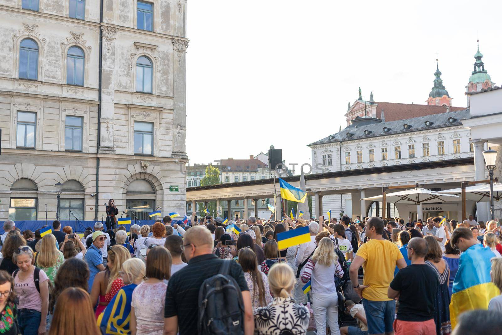 LJUBLJANA, SLOVENIA - August 24, 2022: Ukraine independence day meeting. People with flags and national symbols by Chechotkin