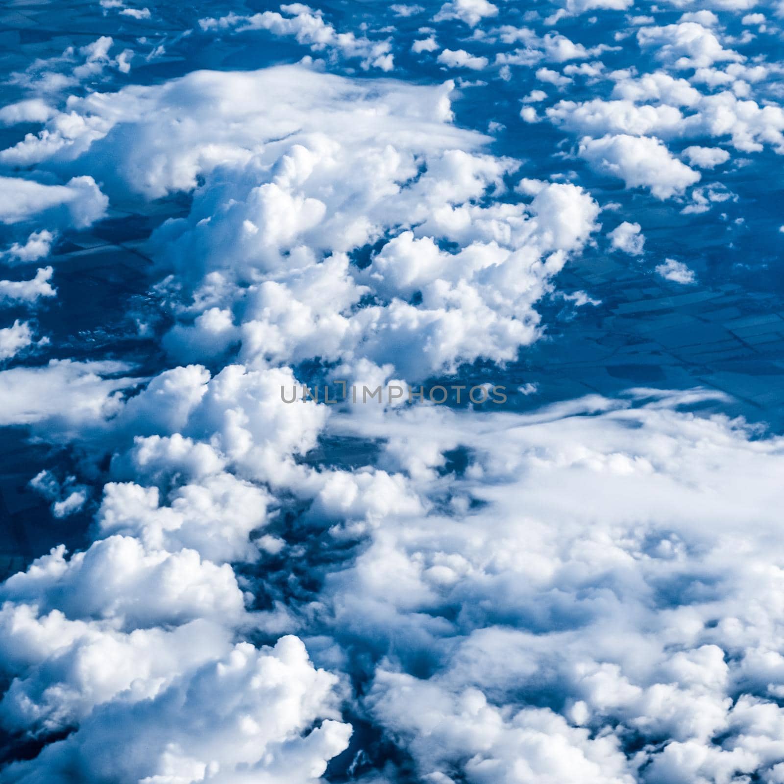 Nature backdrop, solar energy and spiritual concept - Blue sky background, white clouds and bright sunlight