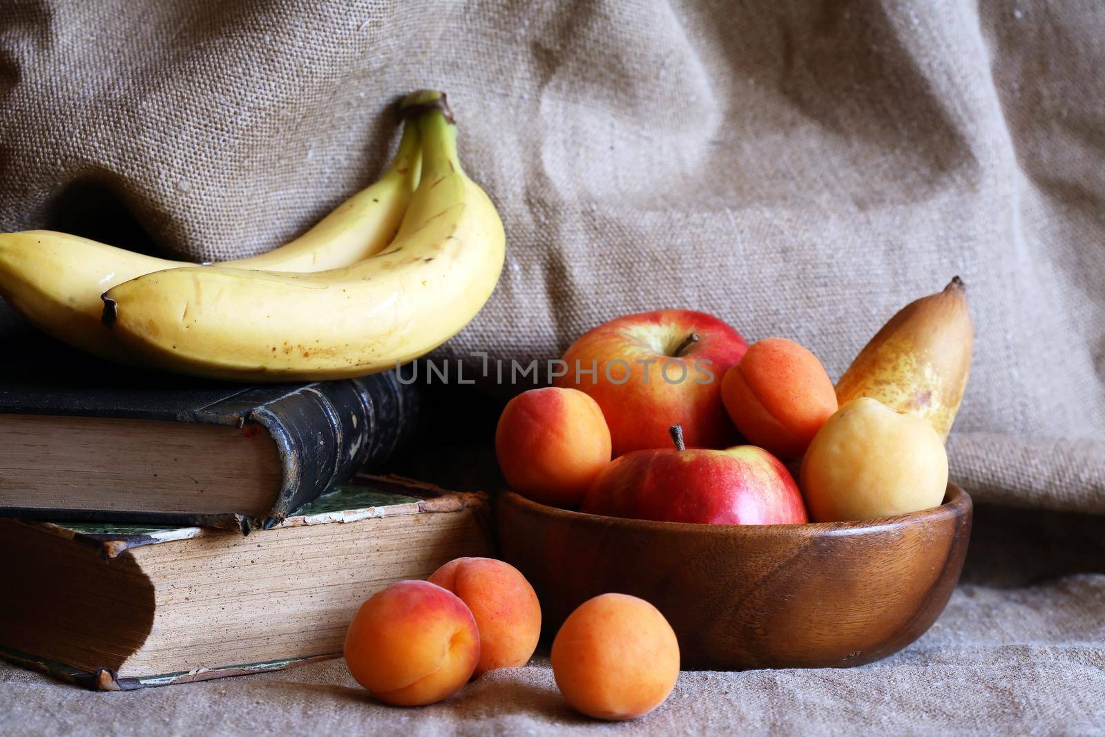 Heap of freshness fruits in  bowl againast nice gray canvas background