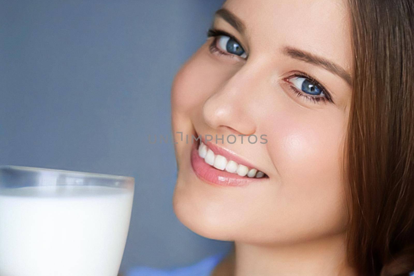 Happy young woman with glass of milk or protein milk shake, healthy cocktail drink for diet and wellness concept