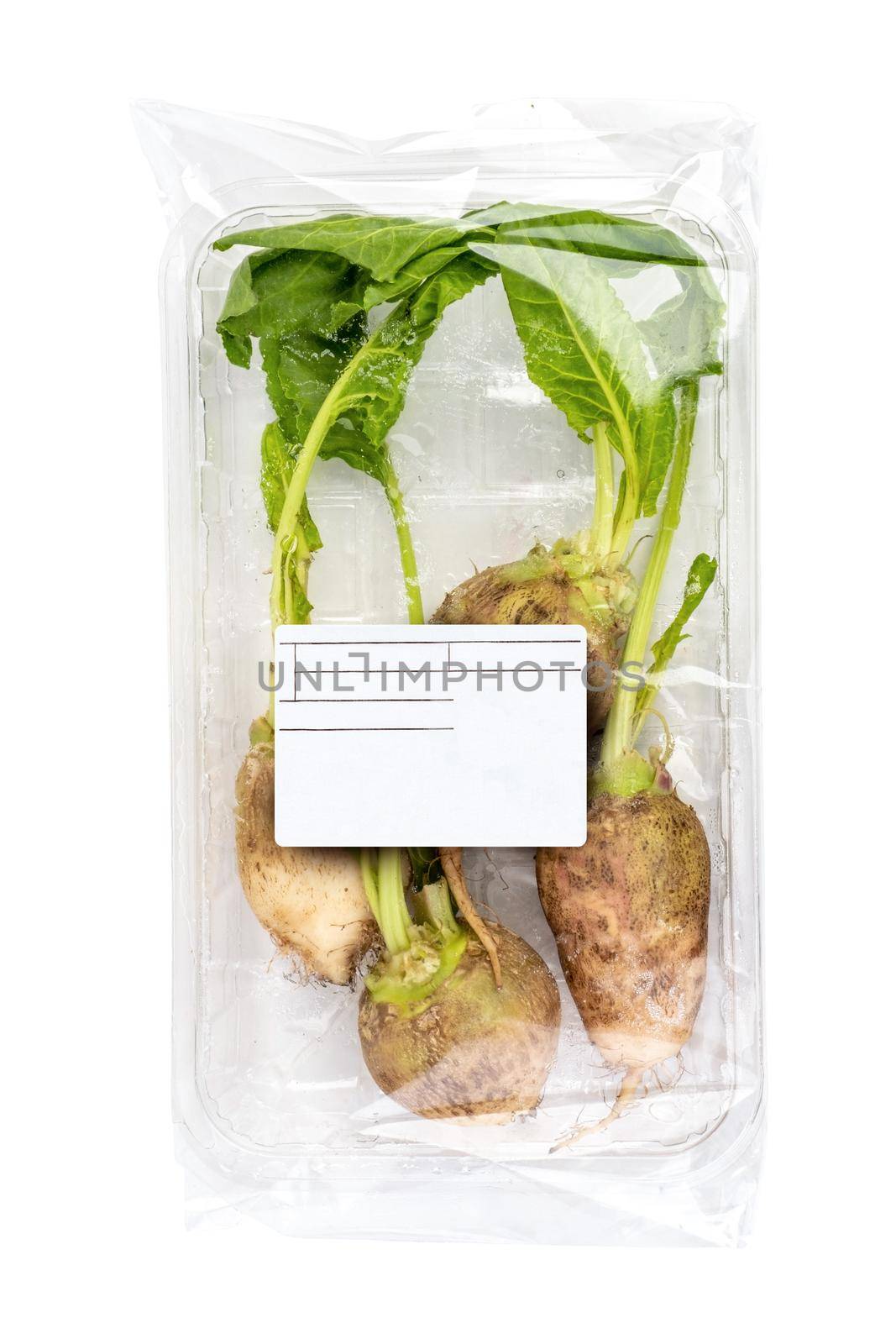 Fresh organic beetroot with freshly harvested leaves on isolated white background