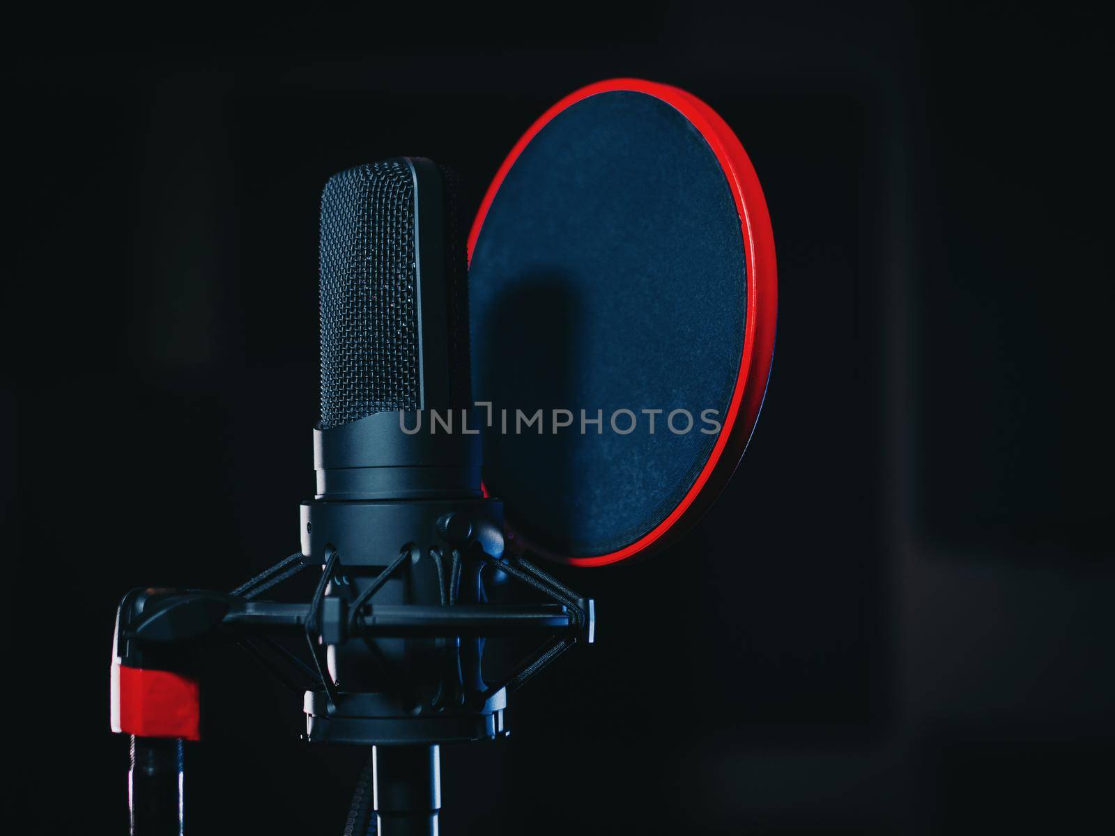 Microphone on black background in recording studio. Music, concert concept. High quality photo