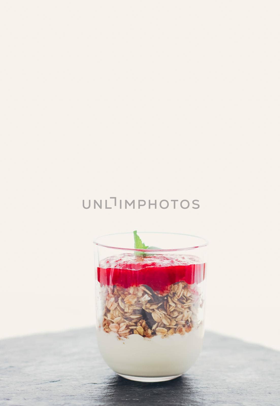 Sweet food, diet nutrition and organic dairy concept - Homemade granola parfait with strawberry jam and mint, yogurt and muesli for healthy breakfast in the morning