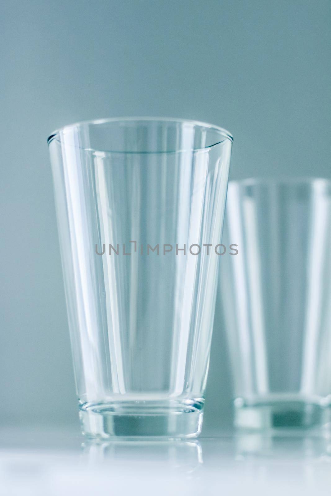Glassware, washing and purity concept - Clean empty glasses on marble table