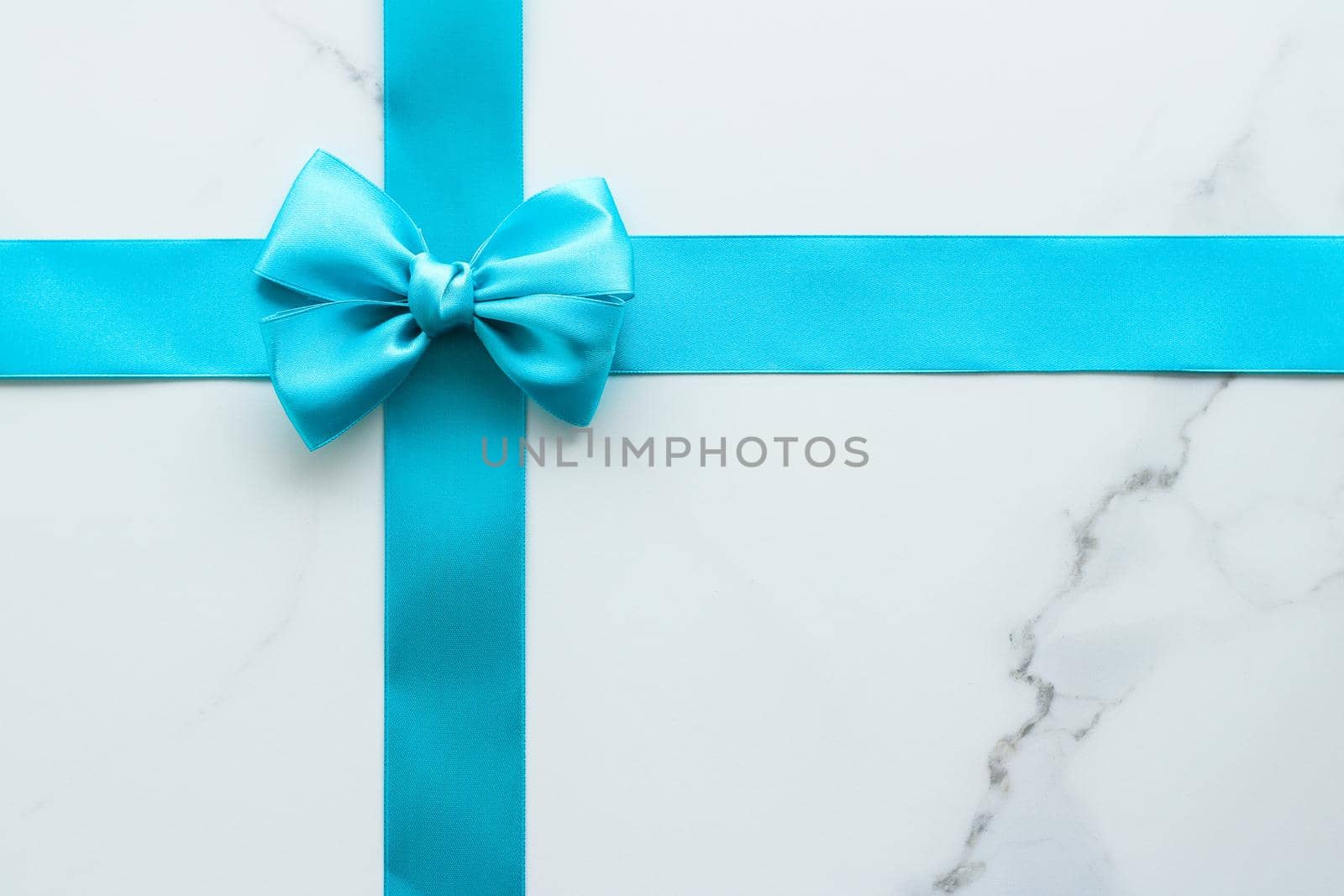 Holiday decor, feminine design and flatlay concept - Blue silk ribbon on marble, top view