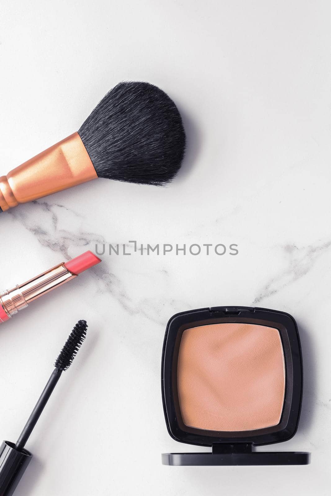 Make-up and cosmetics flatlay on marble by Anneleven