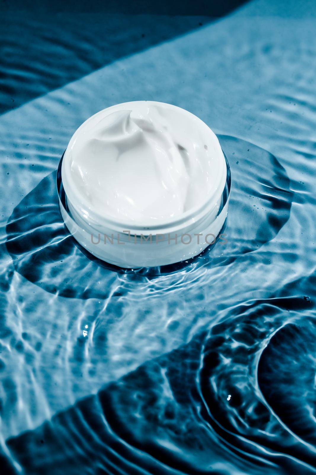 Sensitive skincare moisturizer cream on water background - clean beauty, cosmetic products and luxury body care concept. Natural science for your skin